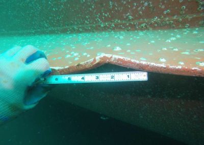 Diver examining Hull Damage